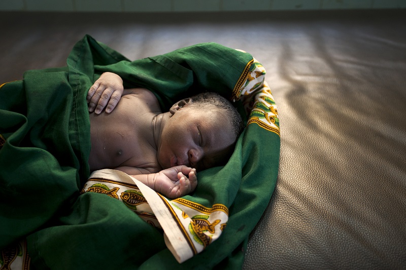 Baby in blanket at clinic in bamako