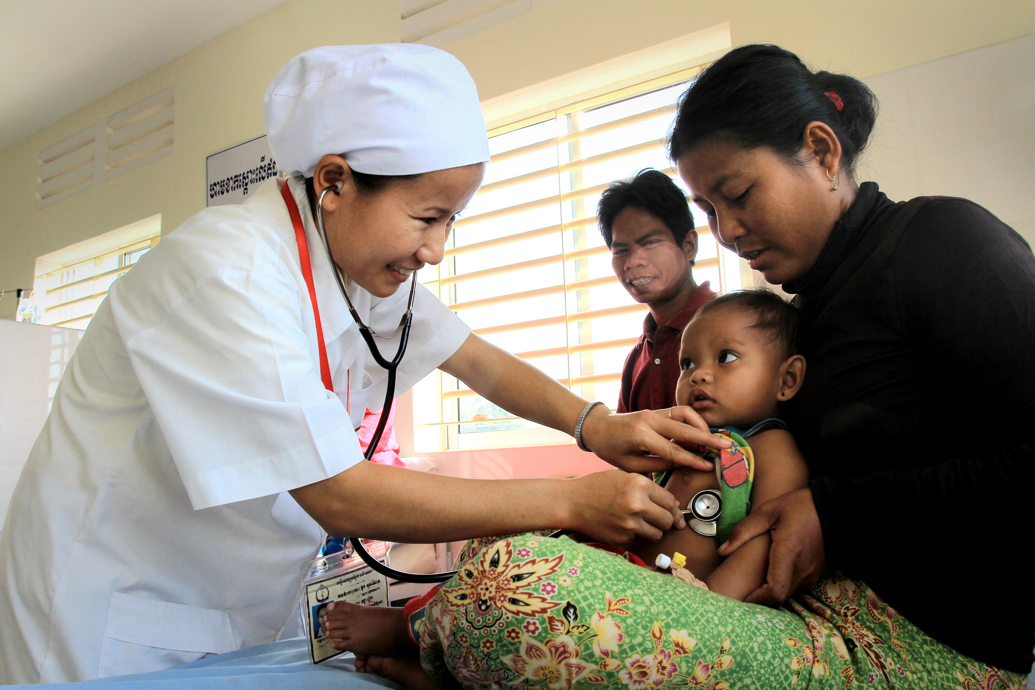 medic examines infant