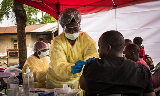 Photo shows patient being vaccinated on the front lines in the DRC 