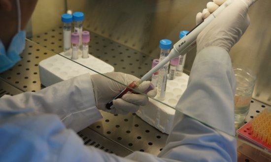 Scientist pipetting in a laboratory