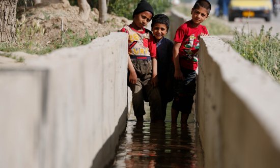 children playing in canal