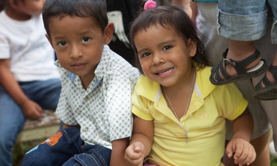 Two children look for water pump opening, Panama Photo: Gerardo Pesantez, World Bank