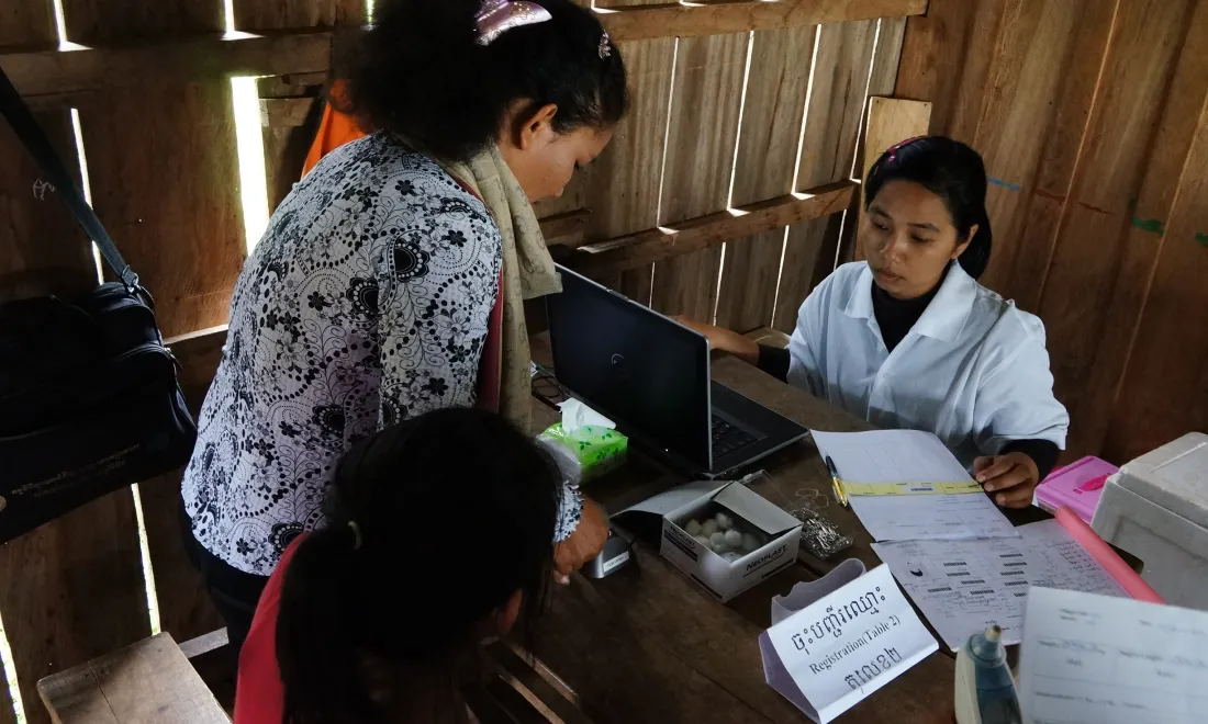 medic with patients in clinic