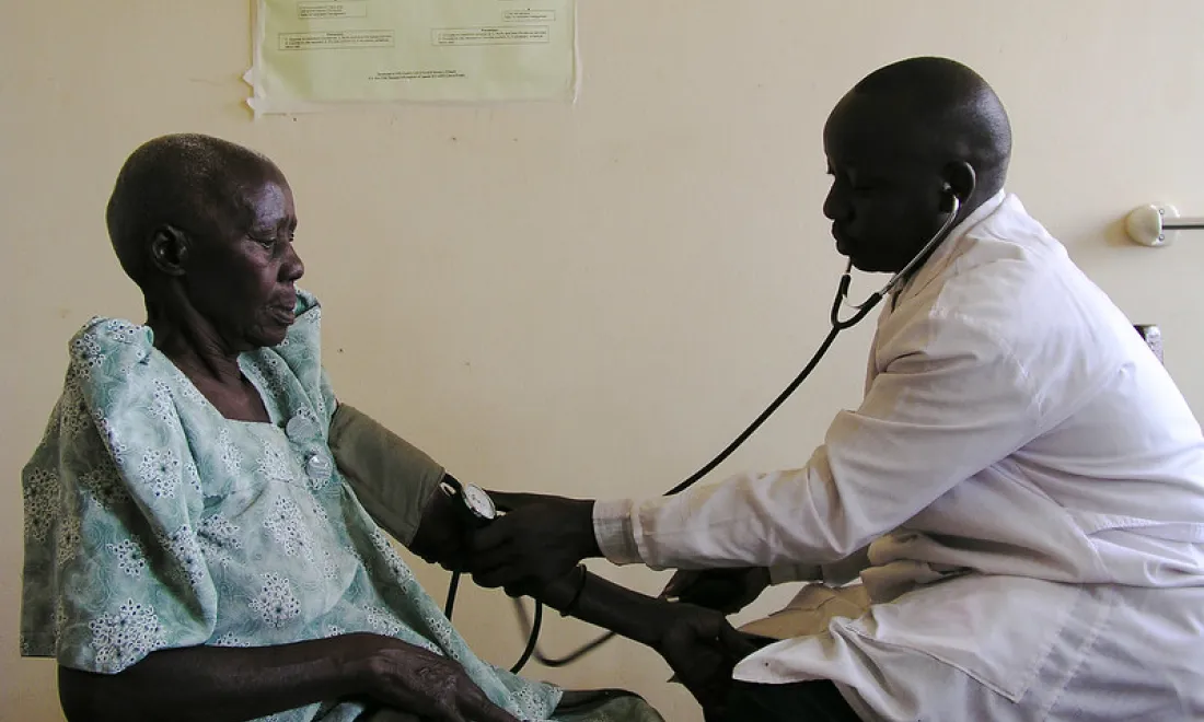 doc with patient in clinic Uganda