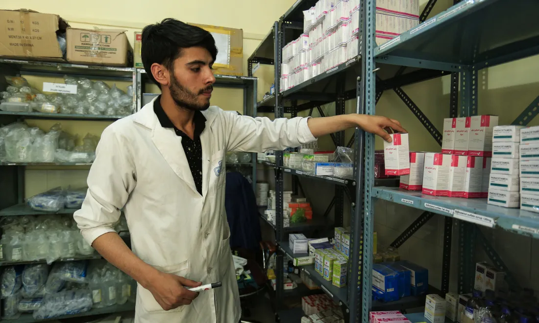 health worker sorts prescriptions - credit Rumi Consultancy, World Bank