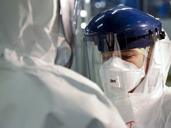 Scientist in protective clothing