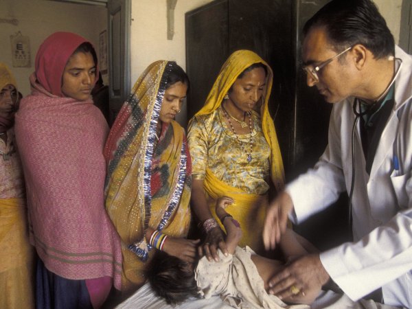Infant patients gets a check up. India. 