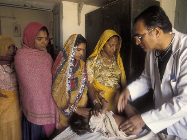 Infant patients gets a check up. India. 