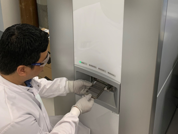 Lead author and DPhil student Yohan Arman loading a MALDI slide into the bioMérieux Vitek-MS used in this study