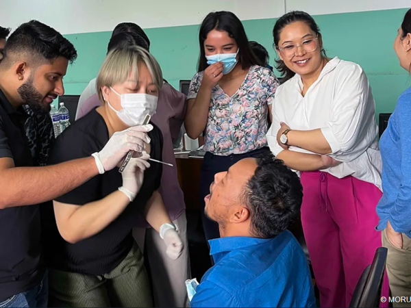 Training in collecting viral samples from the back of the mouth during a site initiation visit (SIV) of the PLATCOV and AD ASTRA clinical trials in Kathmandu, Nepal in June 2024.