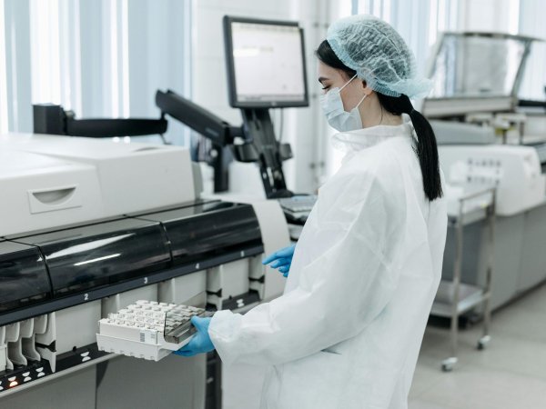 Medical Practitioner holding a Rack of Test Tube Samples