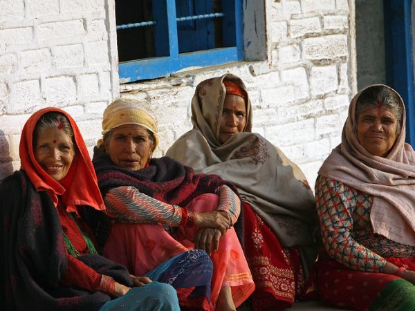 Group of South Asian women in colourful warm clothes