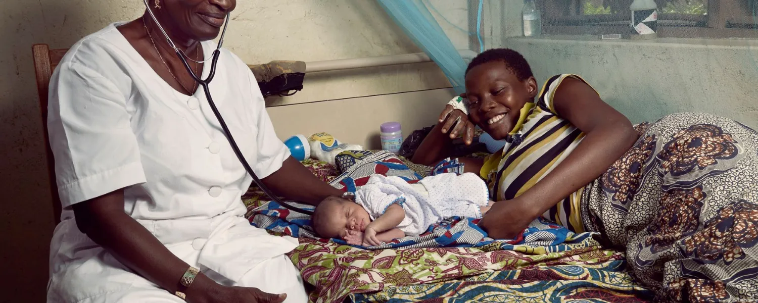 Nurse with mother and babay, Benin, 