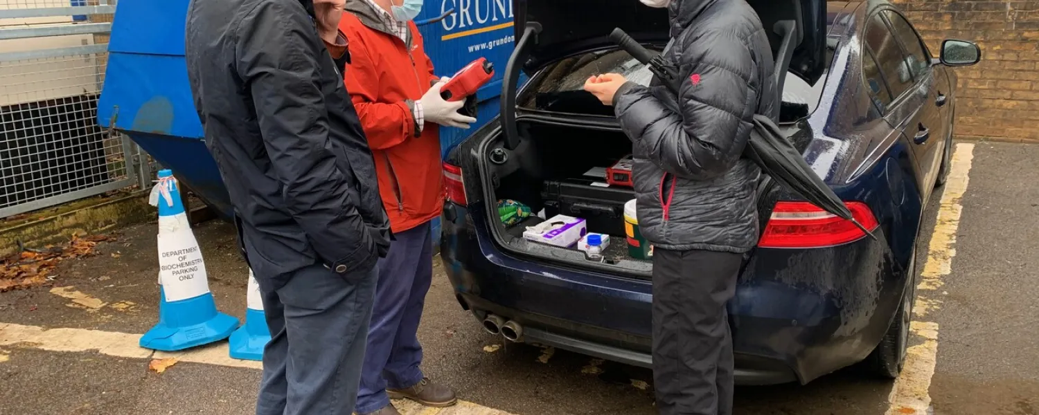 Researchers doing tests in a carpark