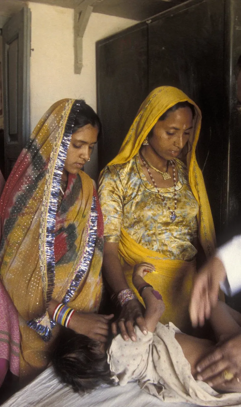 Infant patients gets a check up. India. 