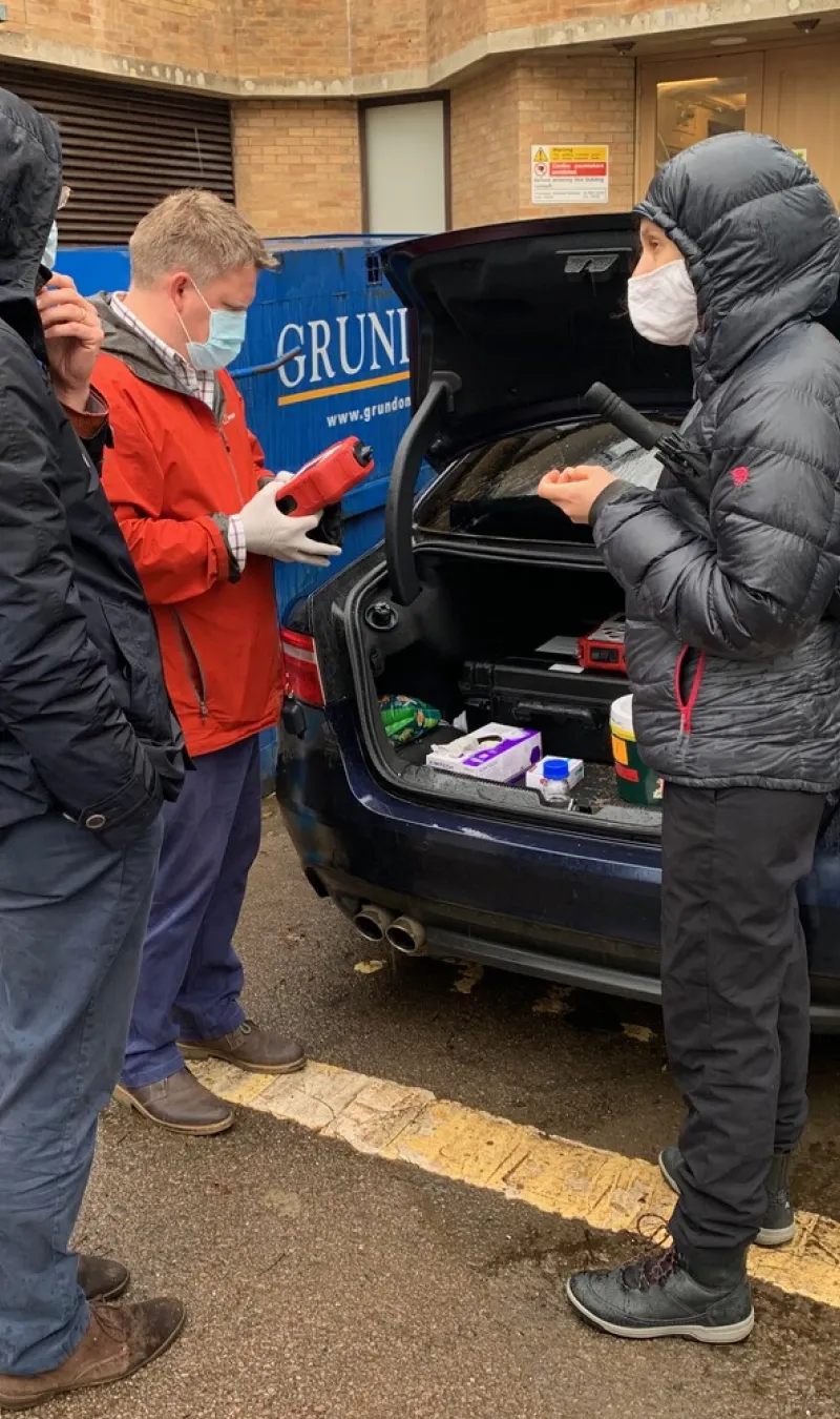 Researchers doing tests in a carpark