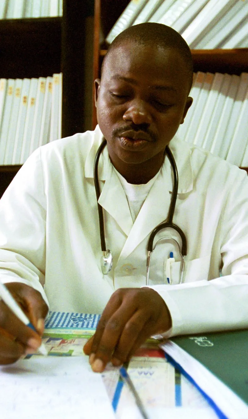 Doctor_ at desk writing
