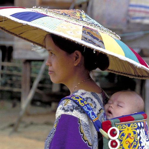 woman with baby in back sling