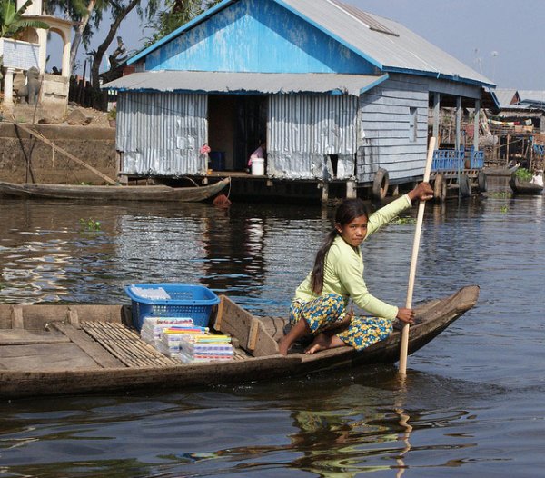 Woman rowing boat, cambodia