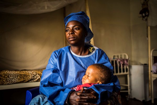 Caregiver with child at Treatment Center