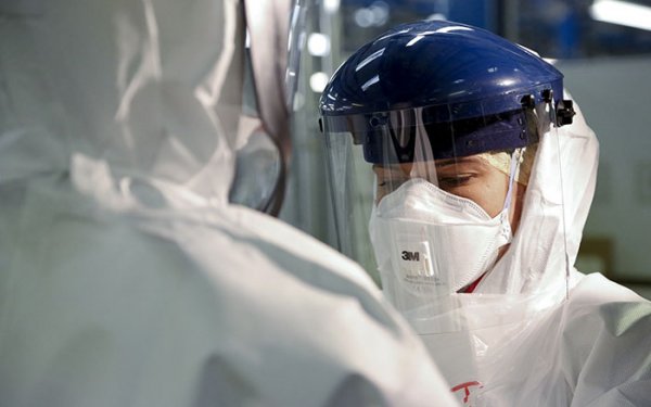 Scientist in protective clothing