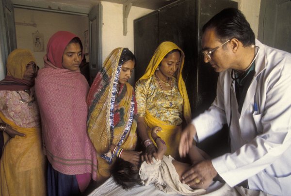 Infant patients gets a check up. India. 