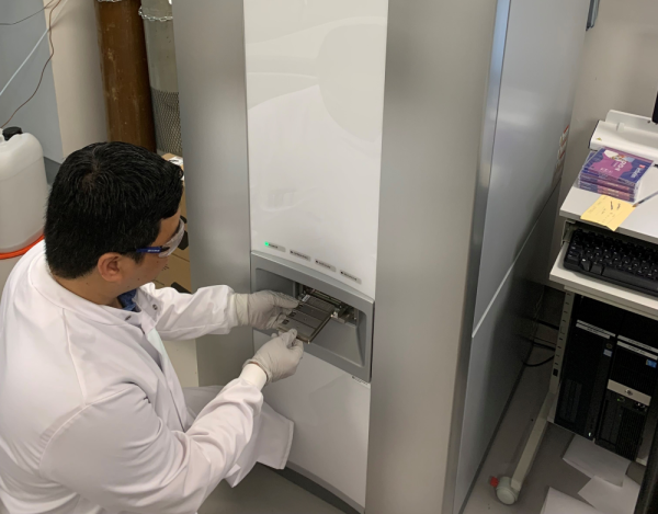 Lead author and DPhil student Yohan Arman loading a MALDI slide into the bioMérieux Vitek-MS used in this study