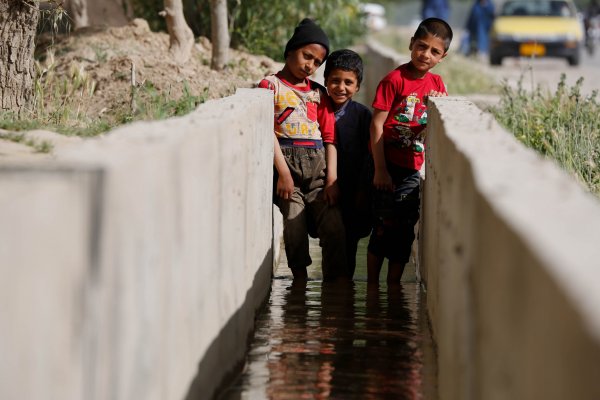 Children playing in canal