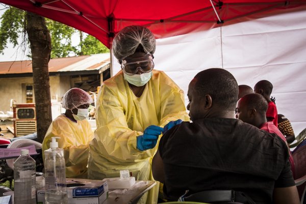 Photo shows patient being vaccinated on the front lines in the DRC 