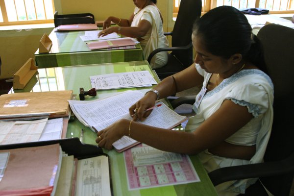 Health worker sorts paperwork